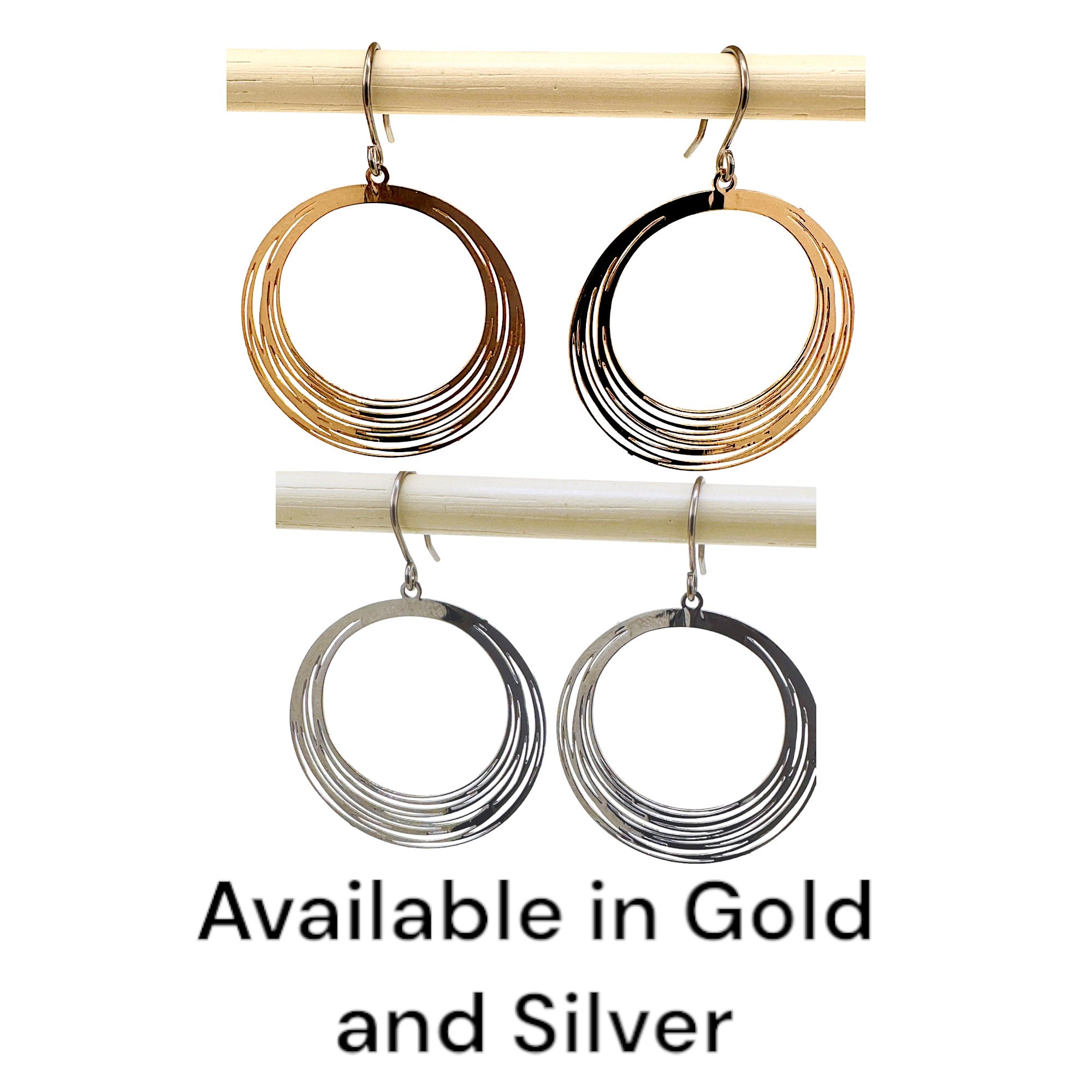 Gold, Silver, String Ring earrings that are round and a titanium hook on a white background