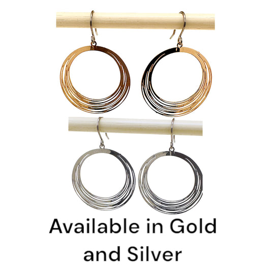 Gold, Silver, String Ring earrings that are round and a titanium hook on a white background