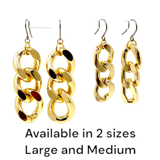 Gold chain earrings and a titanium hook on a white background with lettering