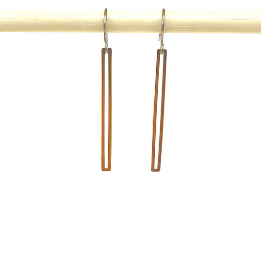 Gold narrow rectangular loop earring with a titanium hook on a white background
