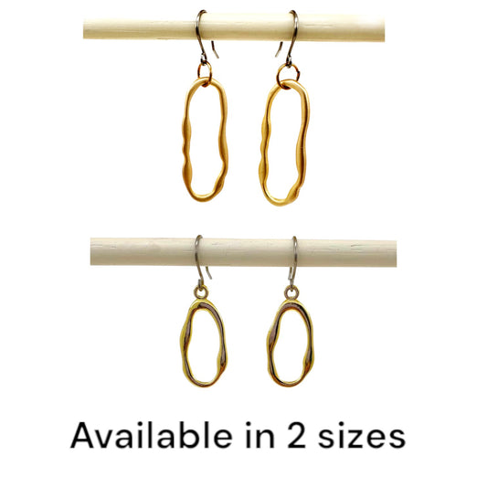 Gold oblong loop minimal earrings with a titanium hook on a white background available in 2 sizes