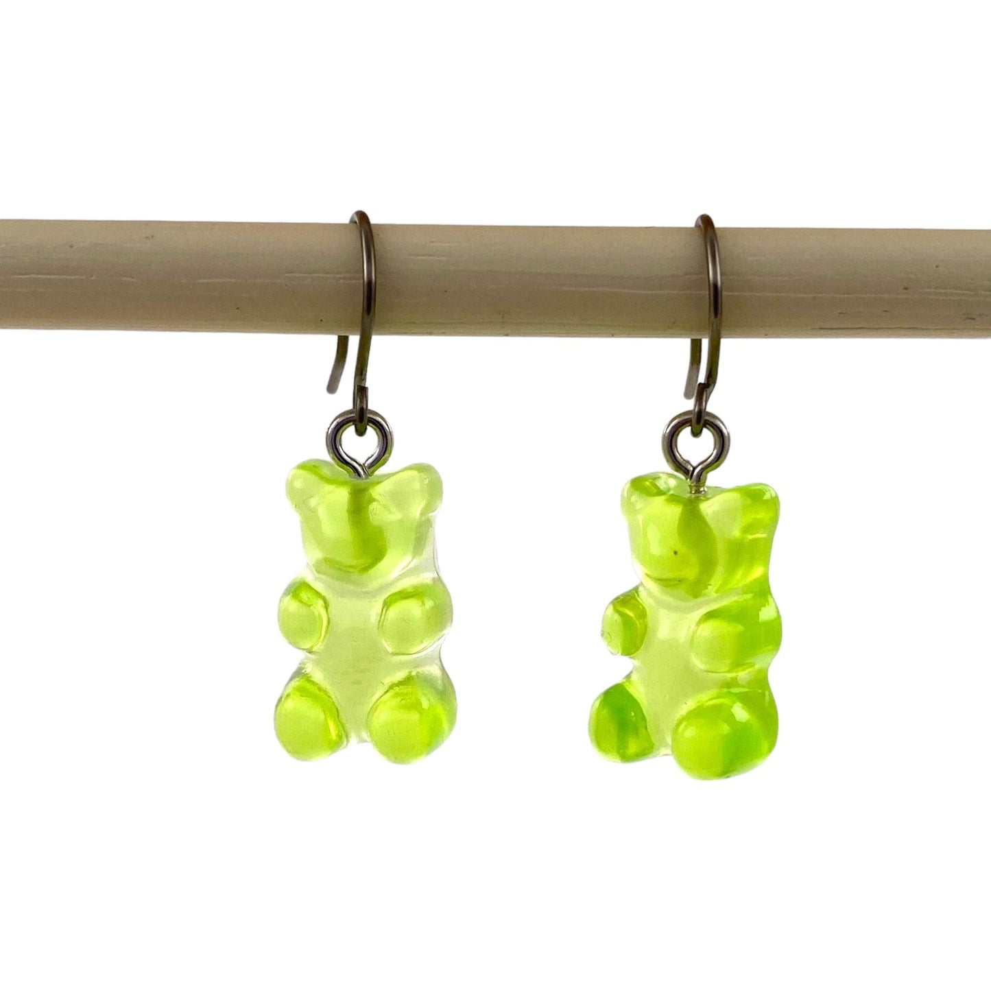 Gummy bear earrings with a titanium hook on a white background. green