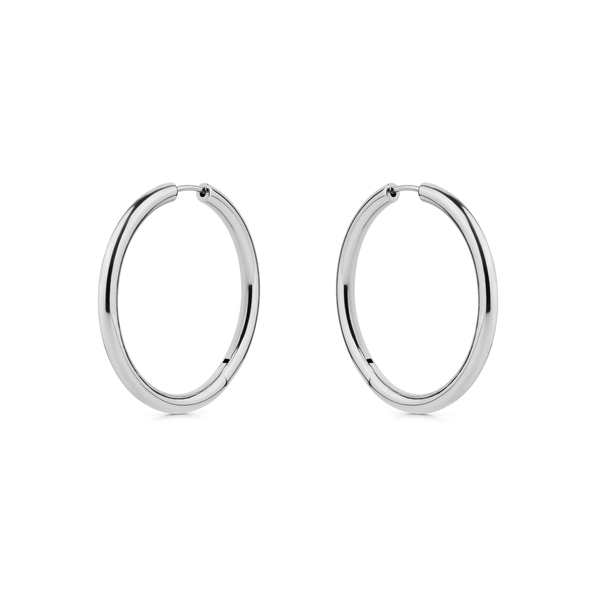 Pair of silver titanium hoop earrings on a white background