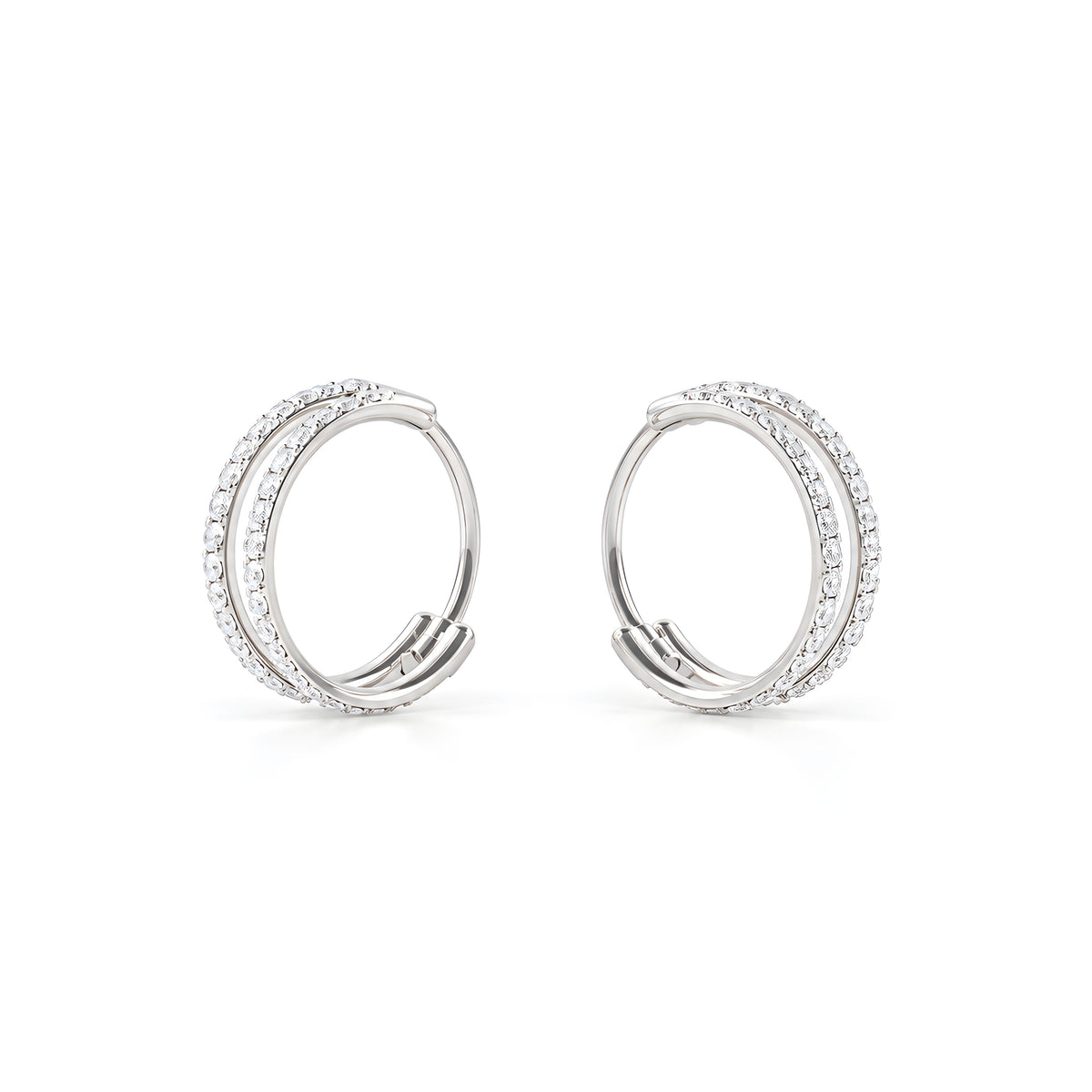 A close-up of a pair of titanium small round-shaped hoop earring with diamond gems around both hoops on a white back ground