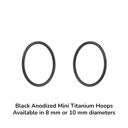 Two black anodized mini titanium hoops on a white background with text indicating size options.