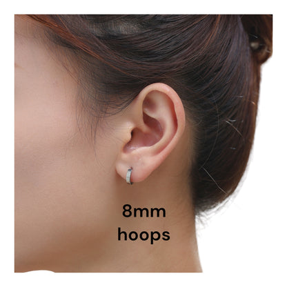Titanium hoop earrings 8mm on a woman with a white background
