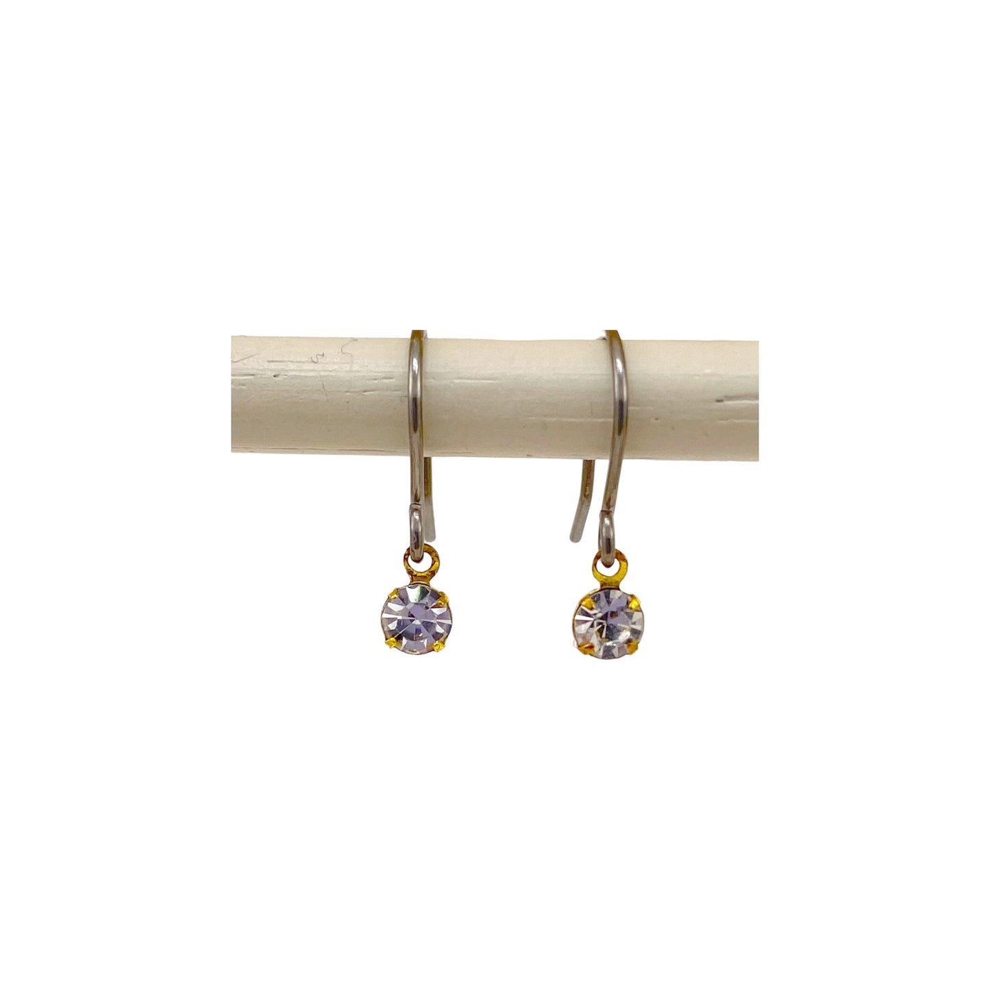 Hanging diamond gem earrings with a titanium hook on a white background