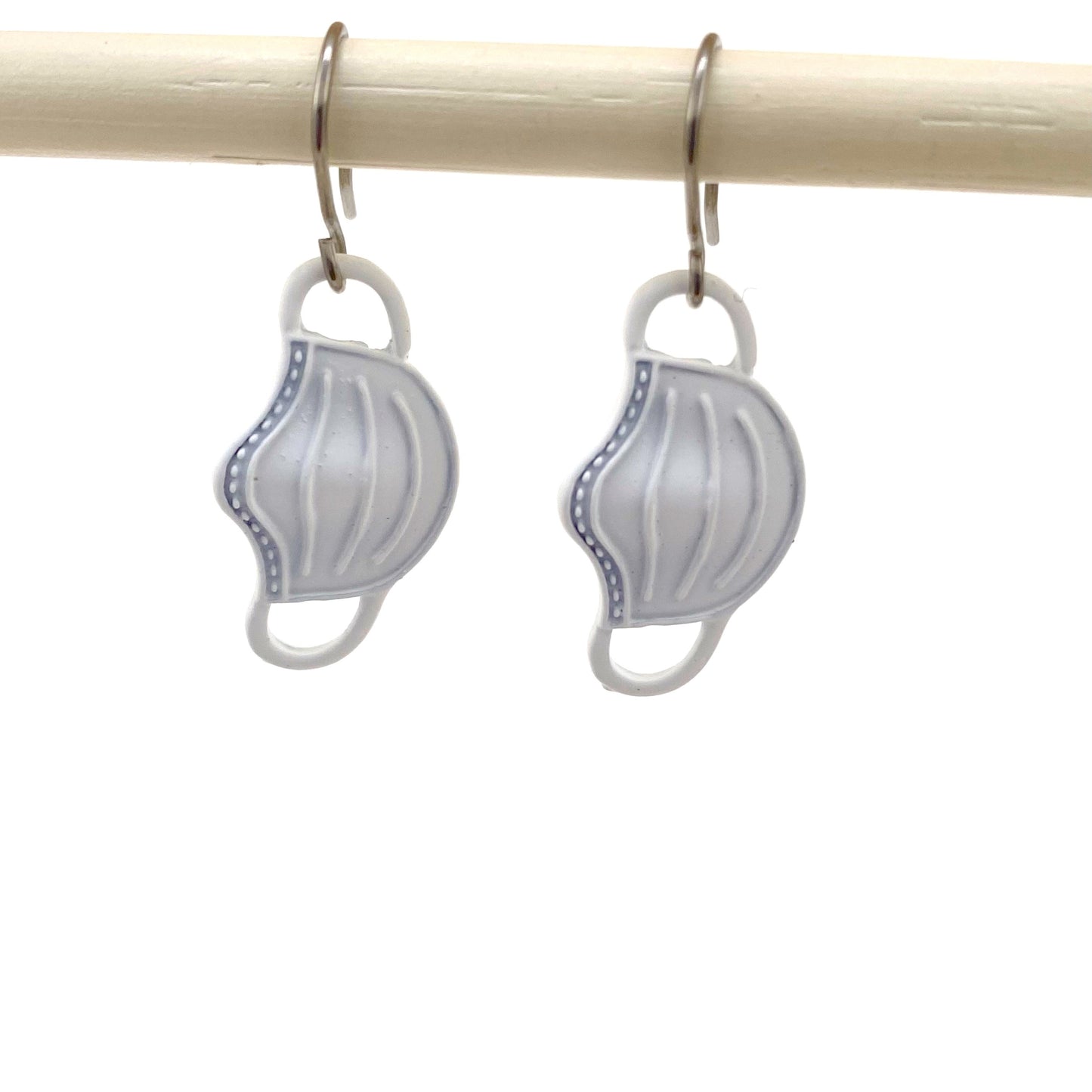 Health care mask earrings with a titanium hook on a white background