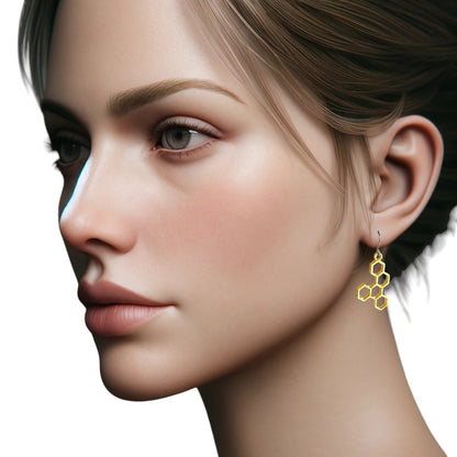 Honeycomb gold earring with a titanium hook on a white young woman.