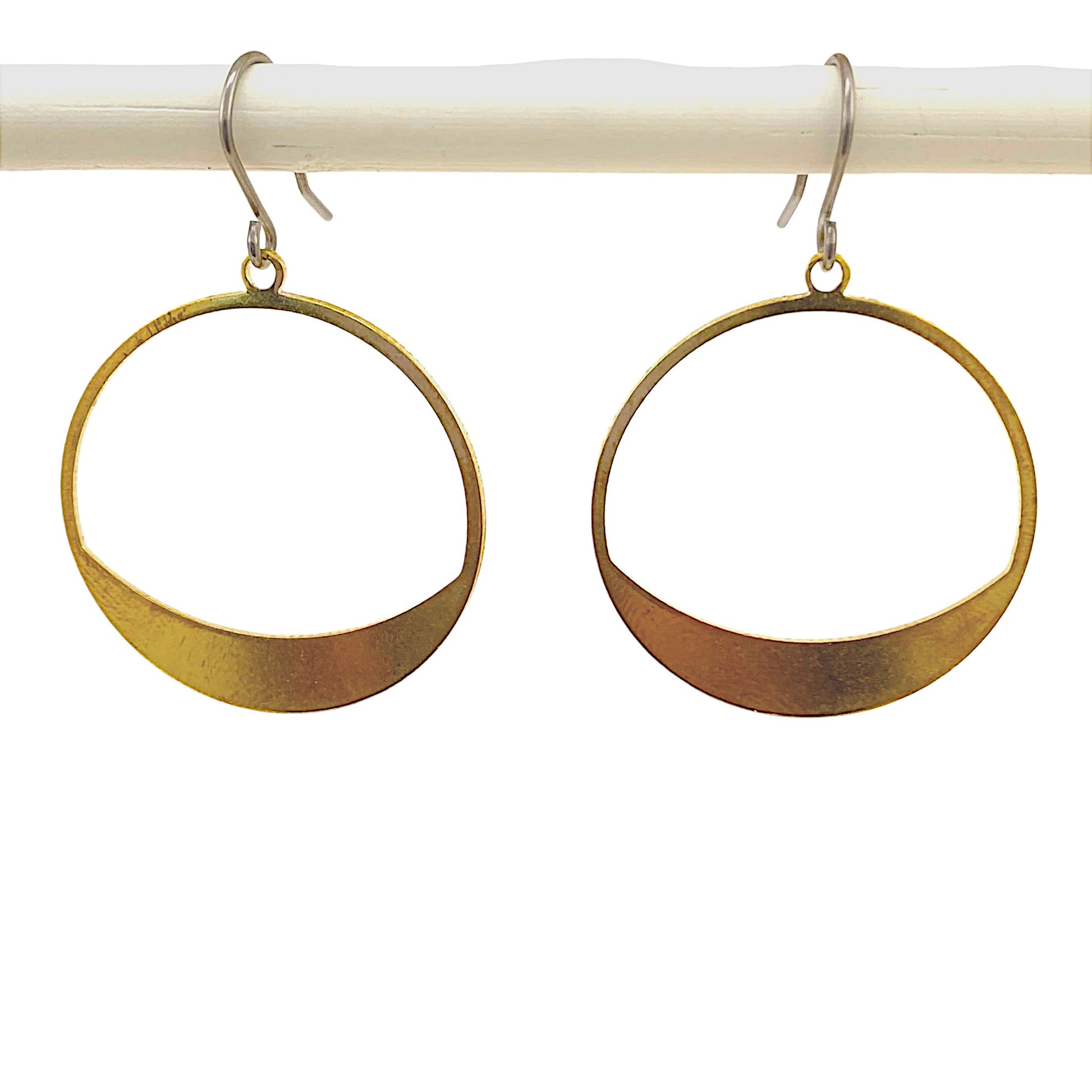 Hoop circles earring with a titanium hook on a white background