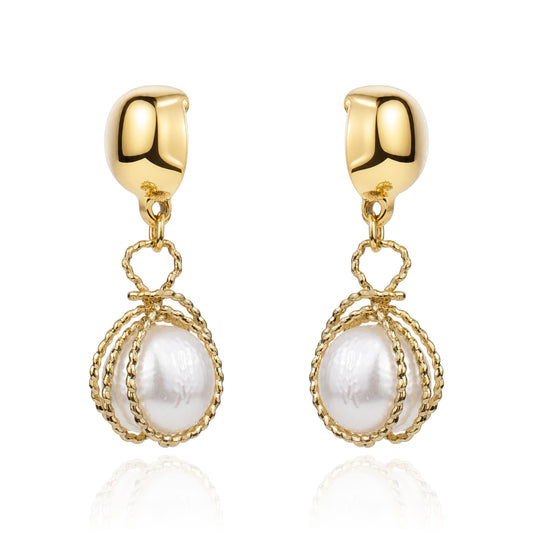 Gold caged pearl earring. Detachable earrings for a truly hypoallergenic jewellery on a white background