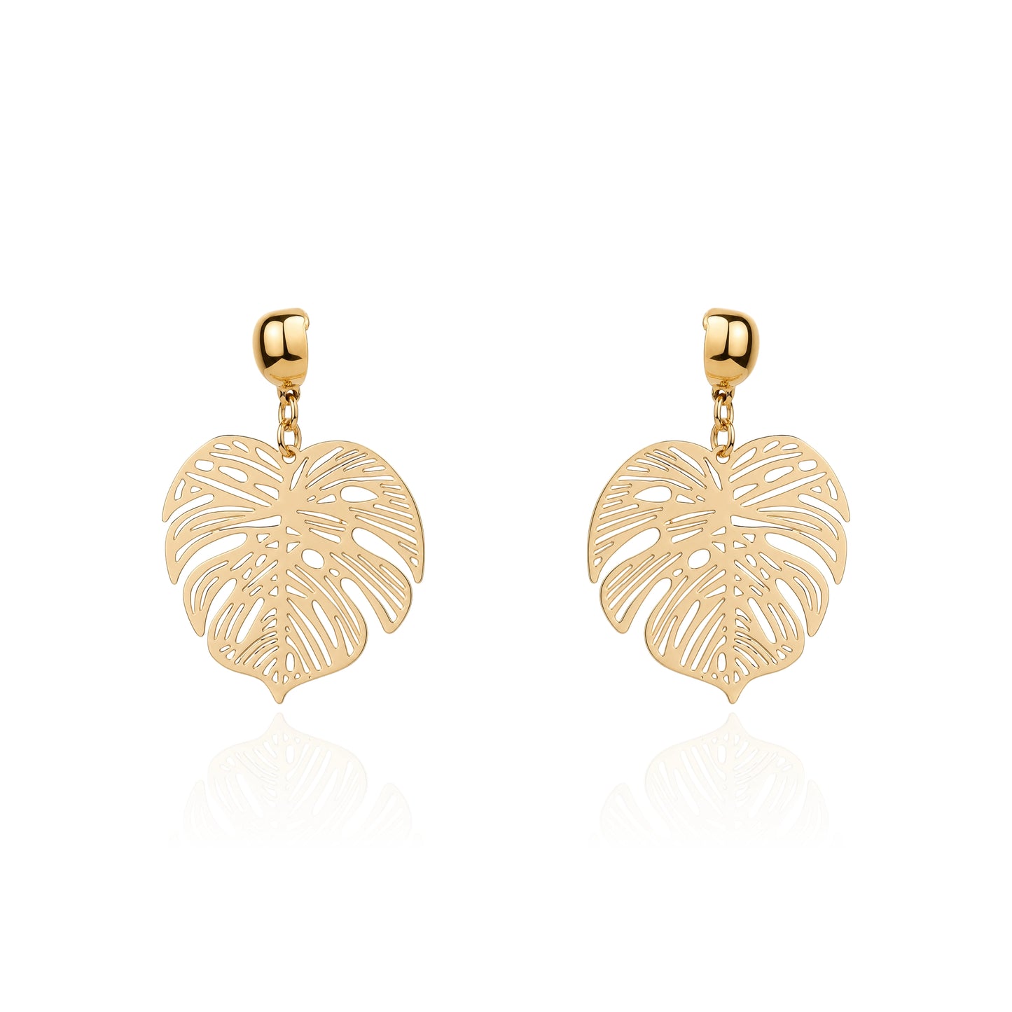 A pair of gold interchangeable drop earrings featuring openwork monstera leaf designs, displayed on a clean white background with a soft reflection below.