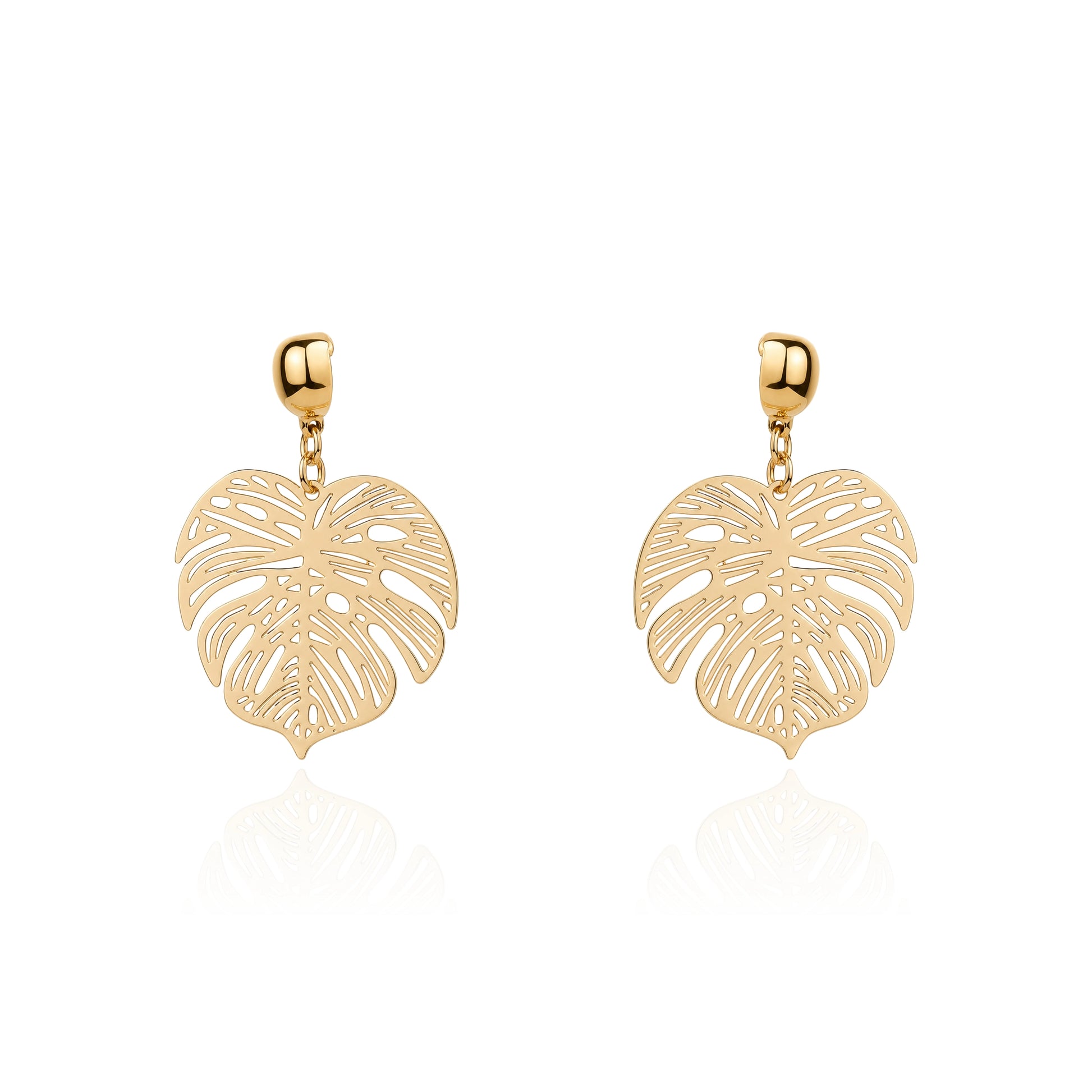 A pair of gold interchangeable drop earrings featuring openwork monstera leaf designs, displayed on a clean white background with a soft reflection below.