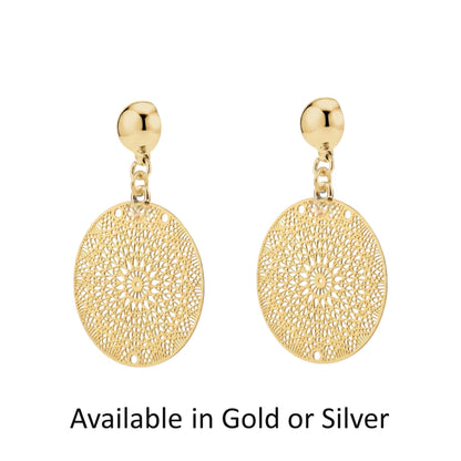 Titanium interchangeable magnetic gold or silver disc earrings with intricate designs on a white background