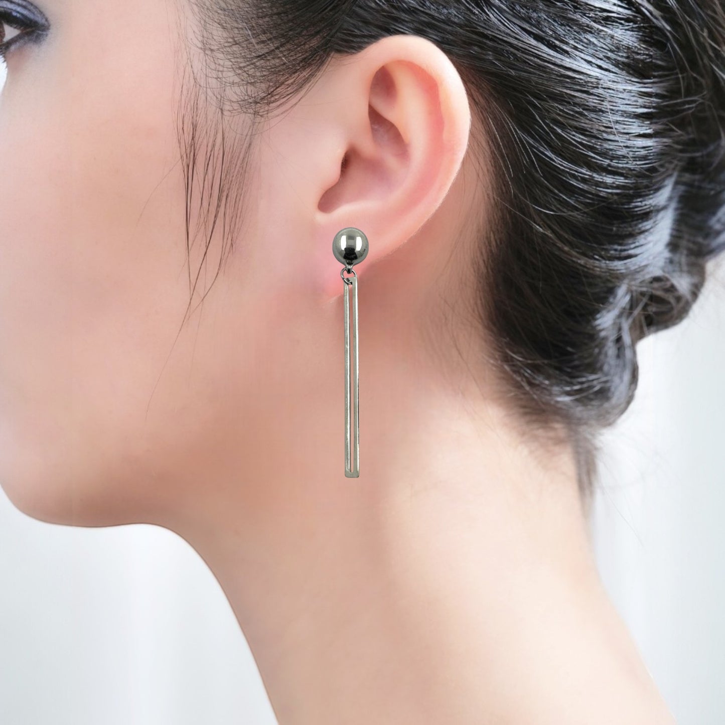 TI-GO silver narrow rectangular loop earring. Detachable earrings for a truly hypoallergenic jewellery on a  young woman.
