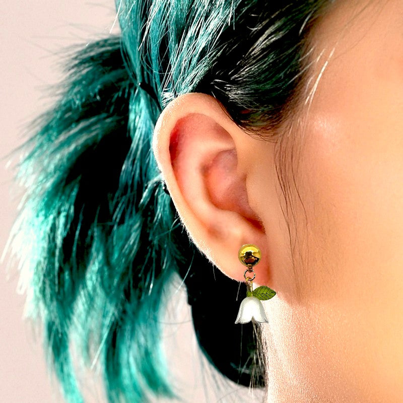 Blue Bell flower titanium interchangeable magnetic white blue bell earrings on a woman