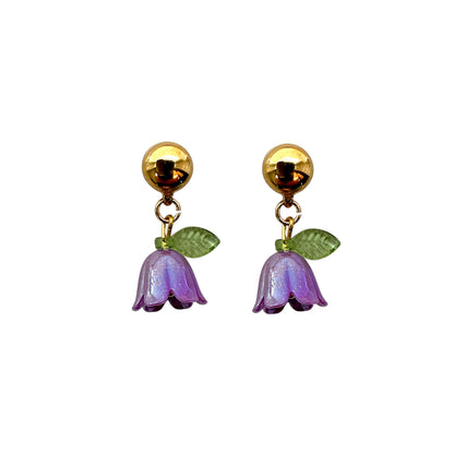 Interchangeable magnetic purple blue bell flower titanium earrings pair on a white background