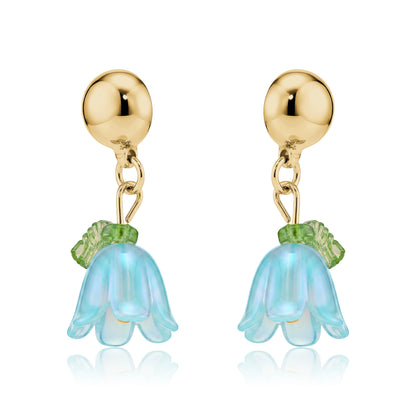Interchangeable magnetic blue bell flower titanium earrings on a white background