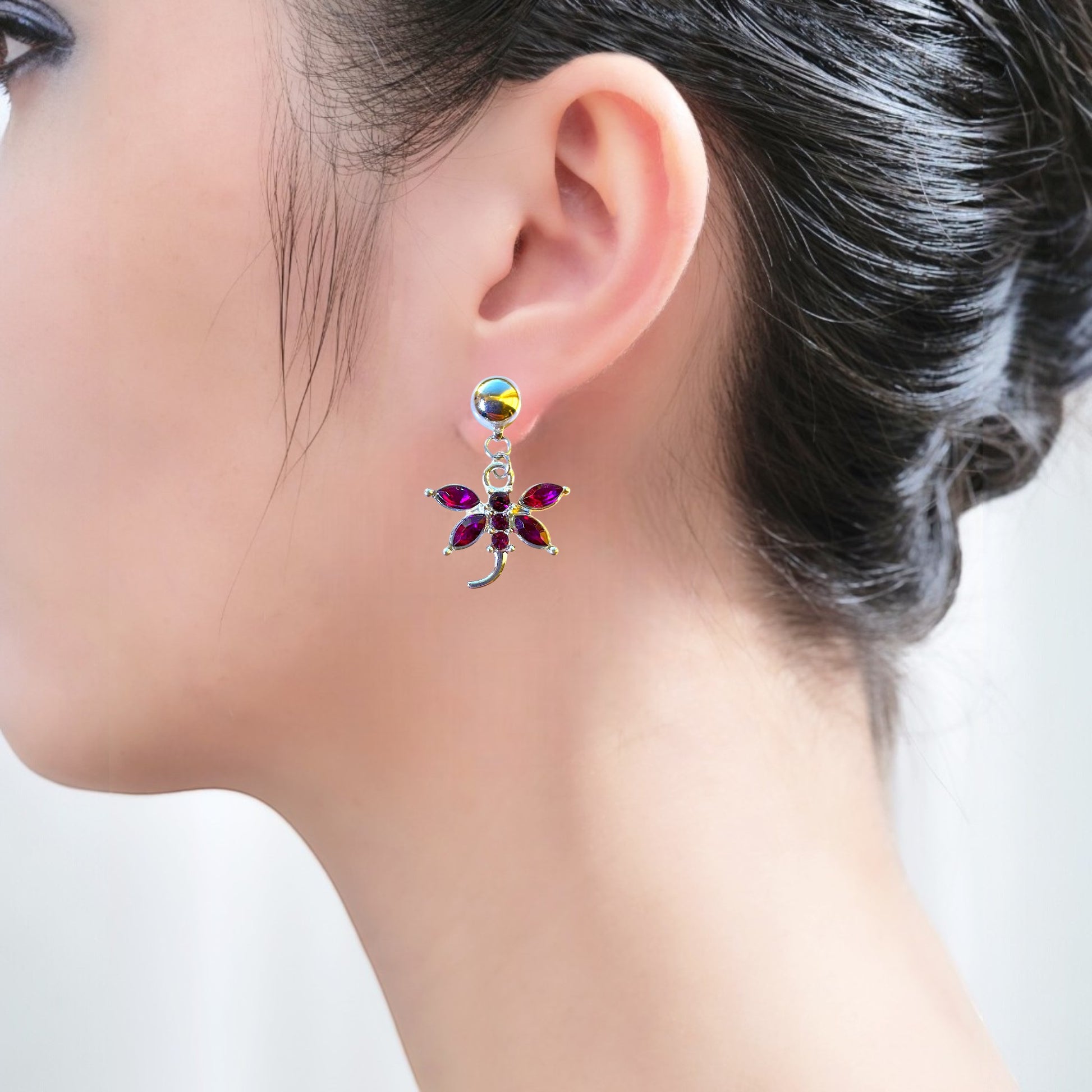 titanium interchangeable earring system on a woman