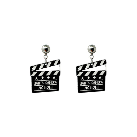 Lights camera action earrings with a titanium magnetic stud on a white background