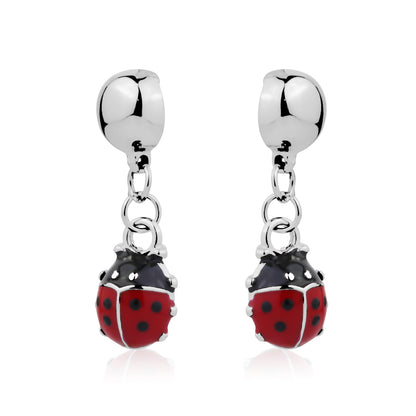 Silver earrings with red and black ladybug charms on a white background