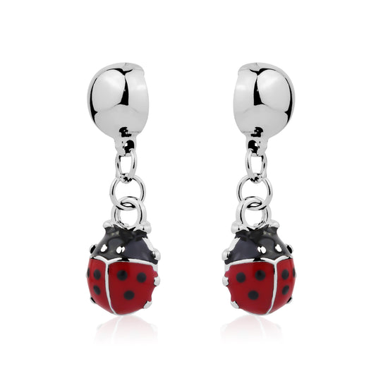 Silver earrings with red and black ladybug charms on a white background