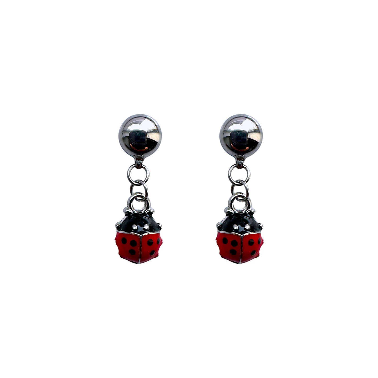 A pair of magnls interchangeable ladybug earrings with red and black color scheme, attached to silver-colored Studs