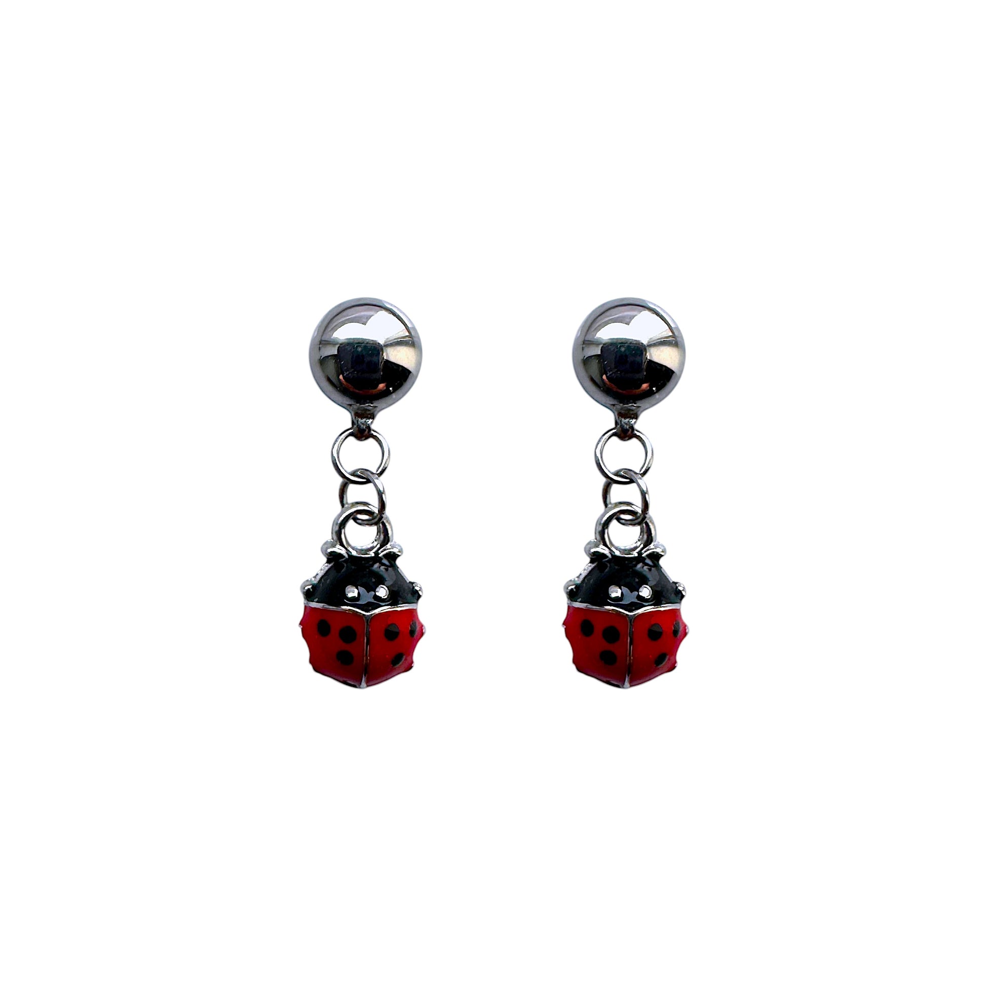 A pair of magnls interchangeable ladybug earrings with red and black color scheme, attached to silver-colored Studs