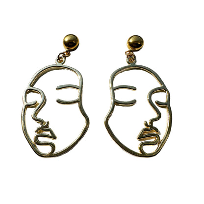 Golden face earrings. Detachable earrings for a truly hypoallergenic jewellery on a white background