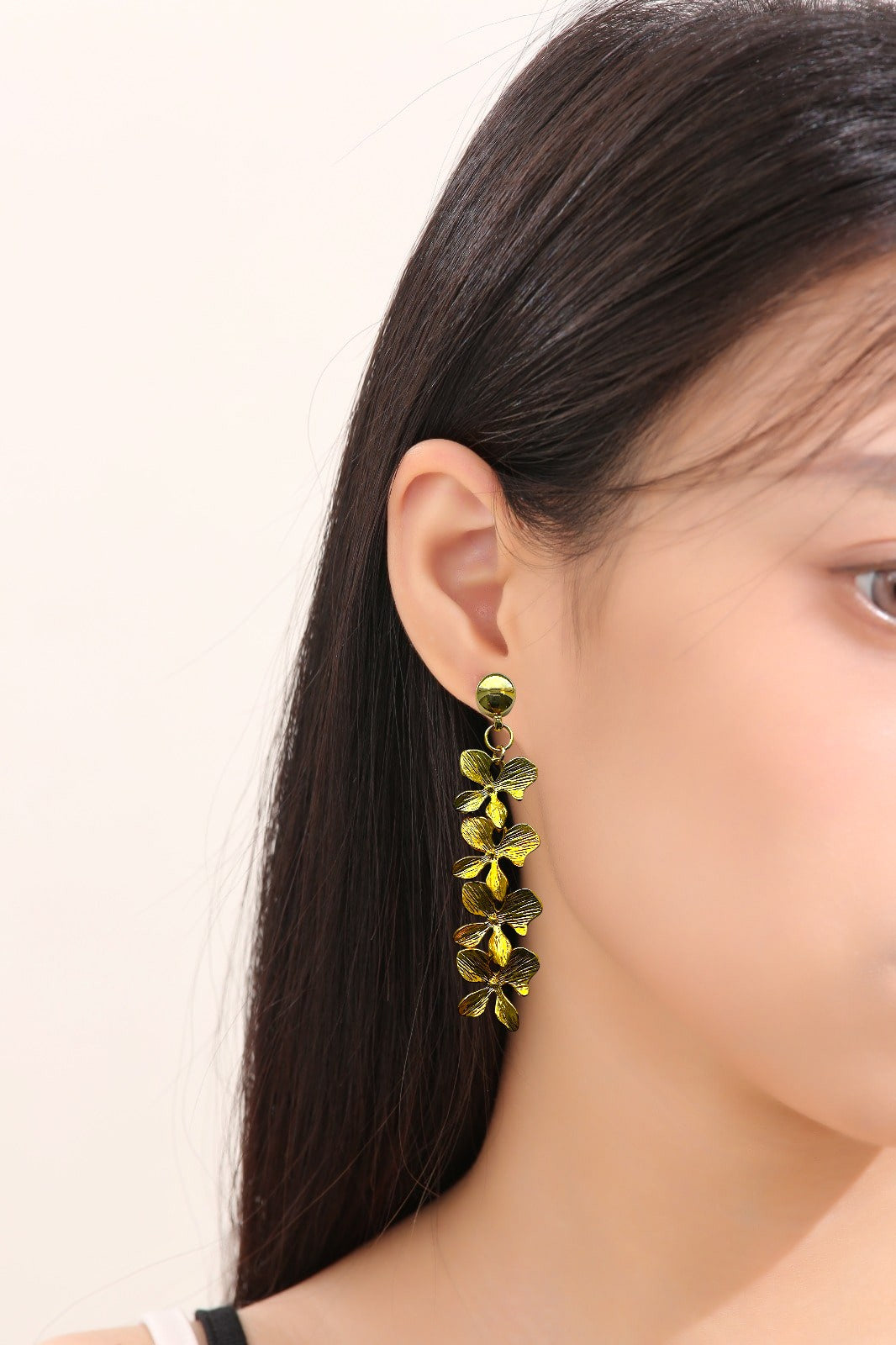 Stylized Long Leaf Earrings. Detachable earrings for a truly hypoallergenic jewellery on a white young woman