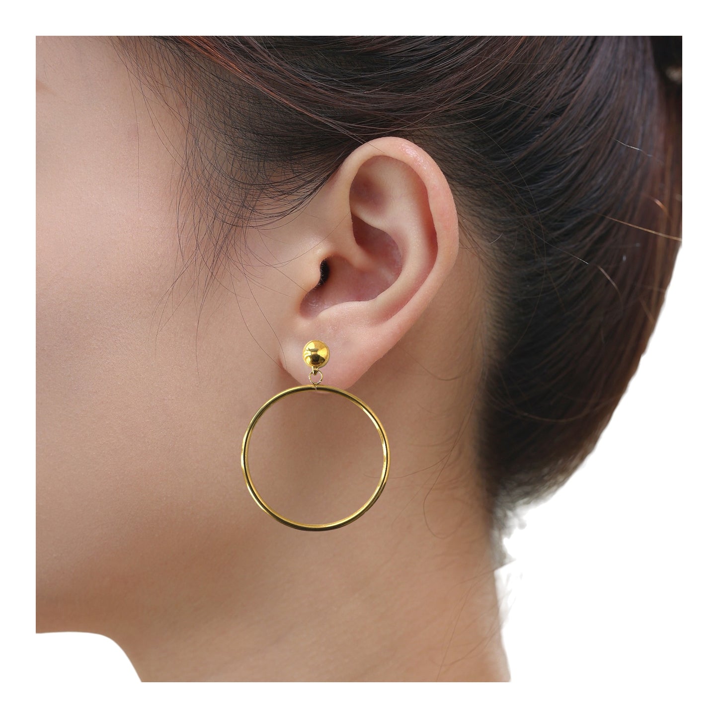 Gold 40mm hoops titanium interchangeable earring system on a woman. Titanium is a hypoallergenic metal that is lightweight and durable perfect choice for those with sensitive ears.