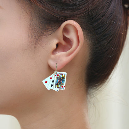 Jeu de cartes earrings with a titanium hook on a white young woman