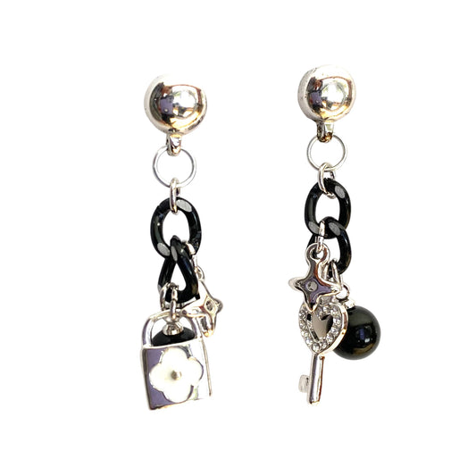 TI-GO Lock and Key Charm earrings. Detachable earrings for a truly hypoallergenic jewellery on a white background