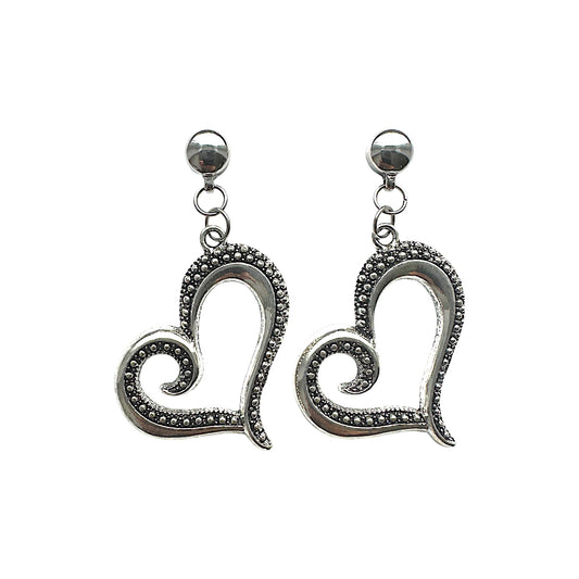 Magnetic Large silver heart earrings. Detachable earrings for a truly hypoallergenic jewellery on a white background