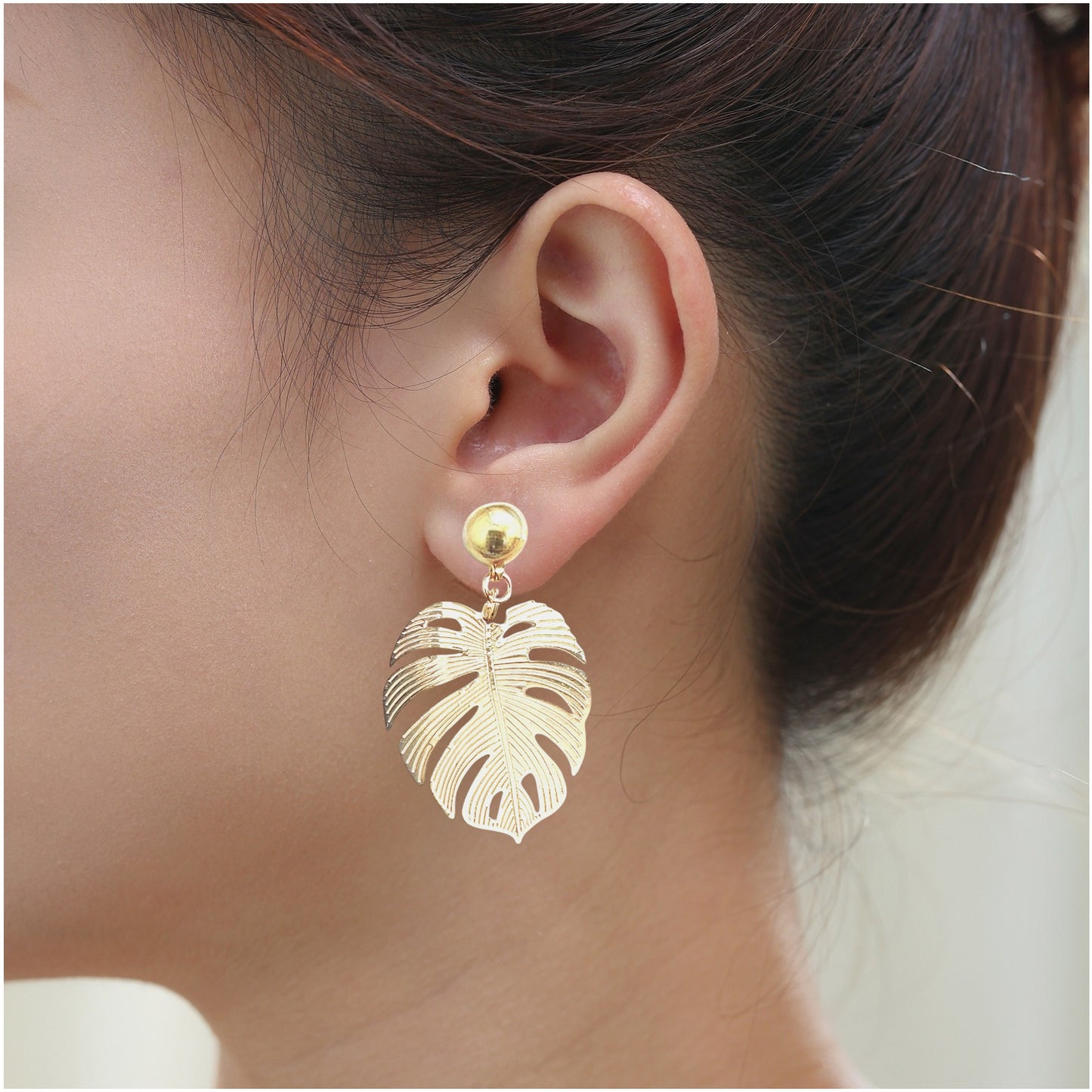  Large Leaf Earrings. Detachable earrings for a truly hypoallergenic jewellery on a white young woman