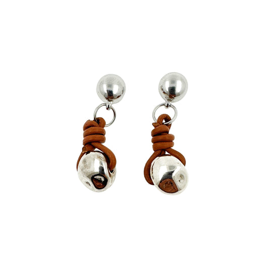 tied silver nugget earrings. Detachable earrings for a truly hypoallergenic jewellery on a white background