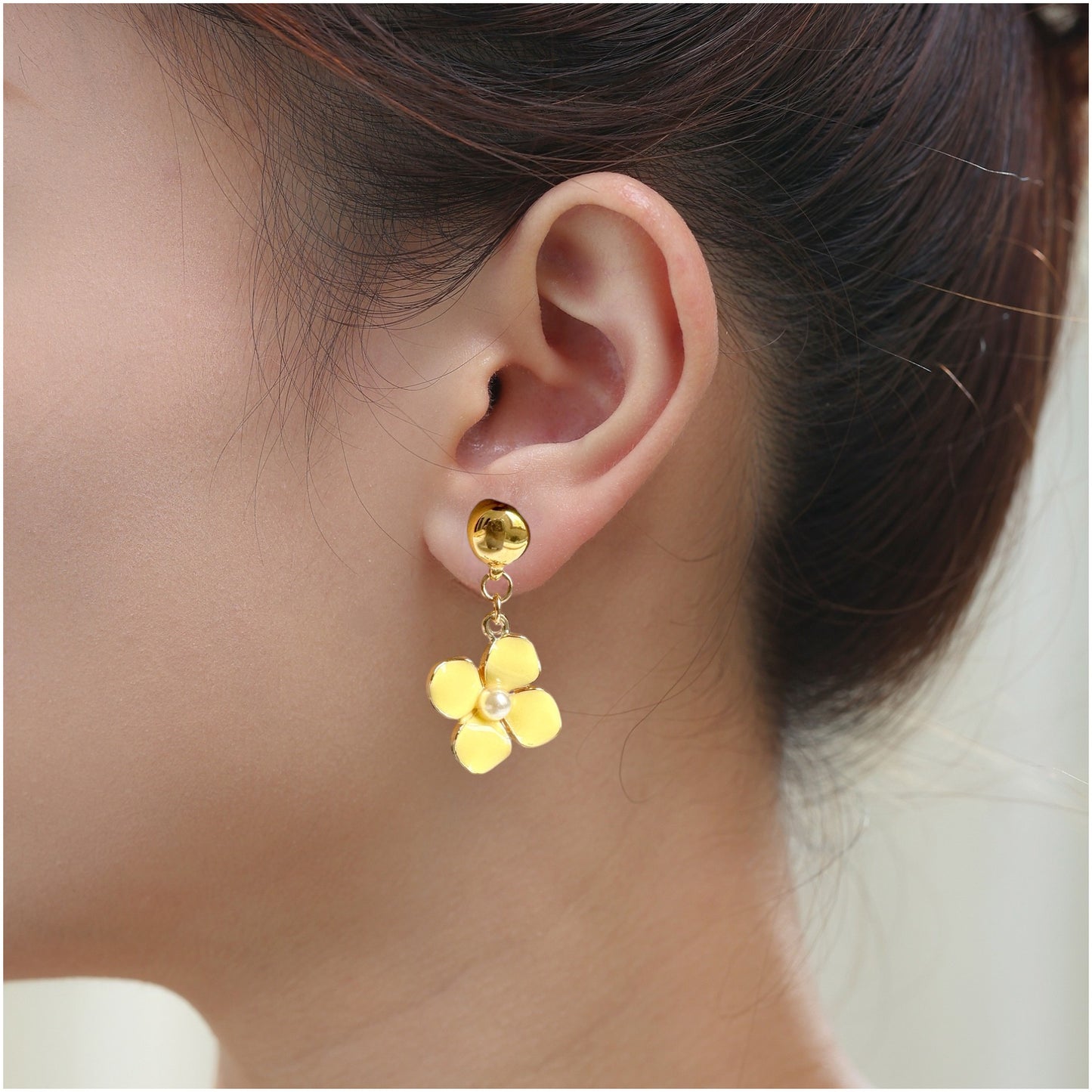 Forget-Me-Not Earrings. Magnetic titanium interchangeable earring system. Detachable earrings for a truly hypoallergenic jewellery on a white young woman. yellow