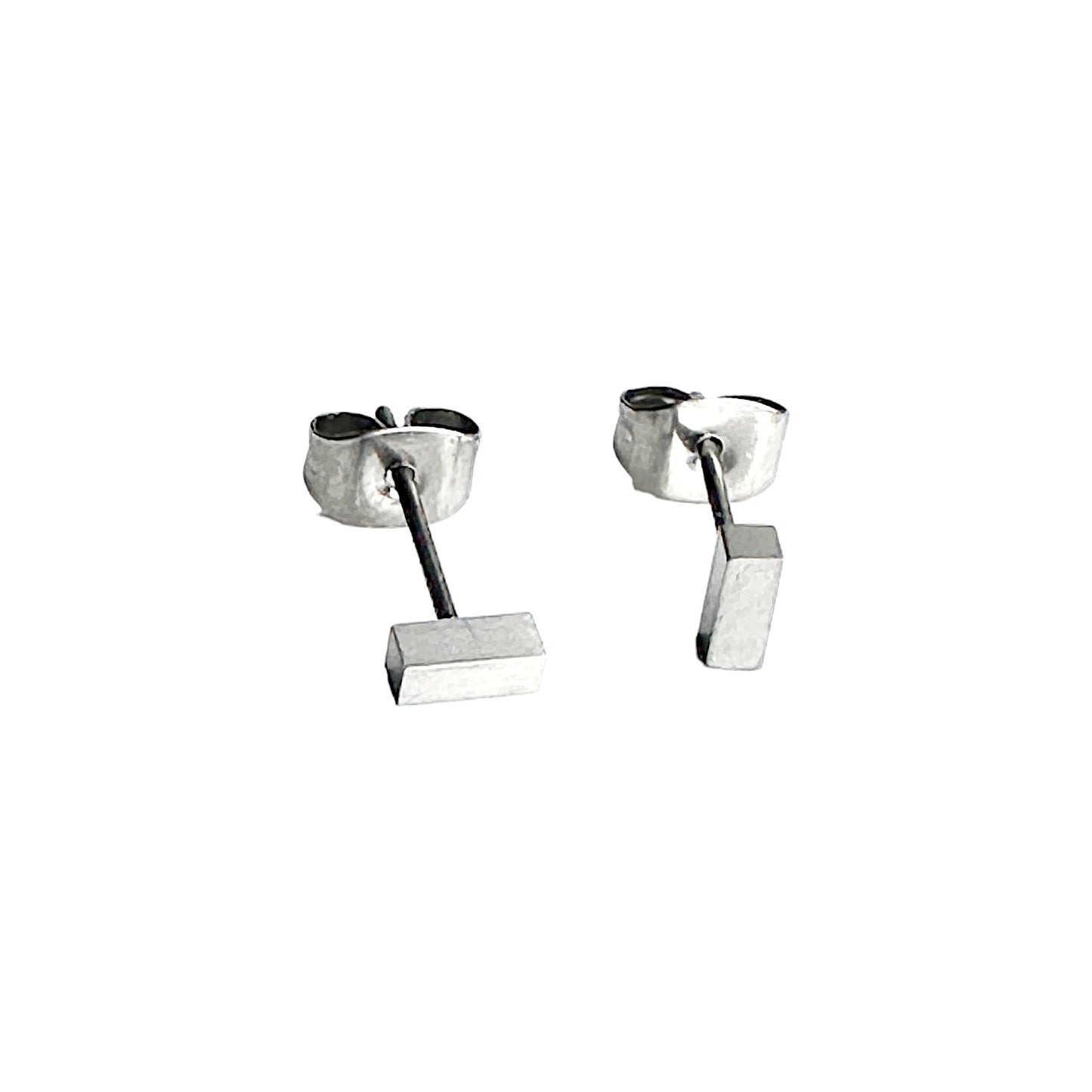 Mini Silver  Bar Studs solid titanium studs and backs on a white background