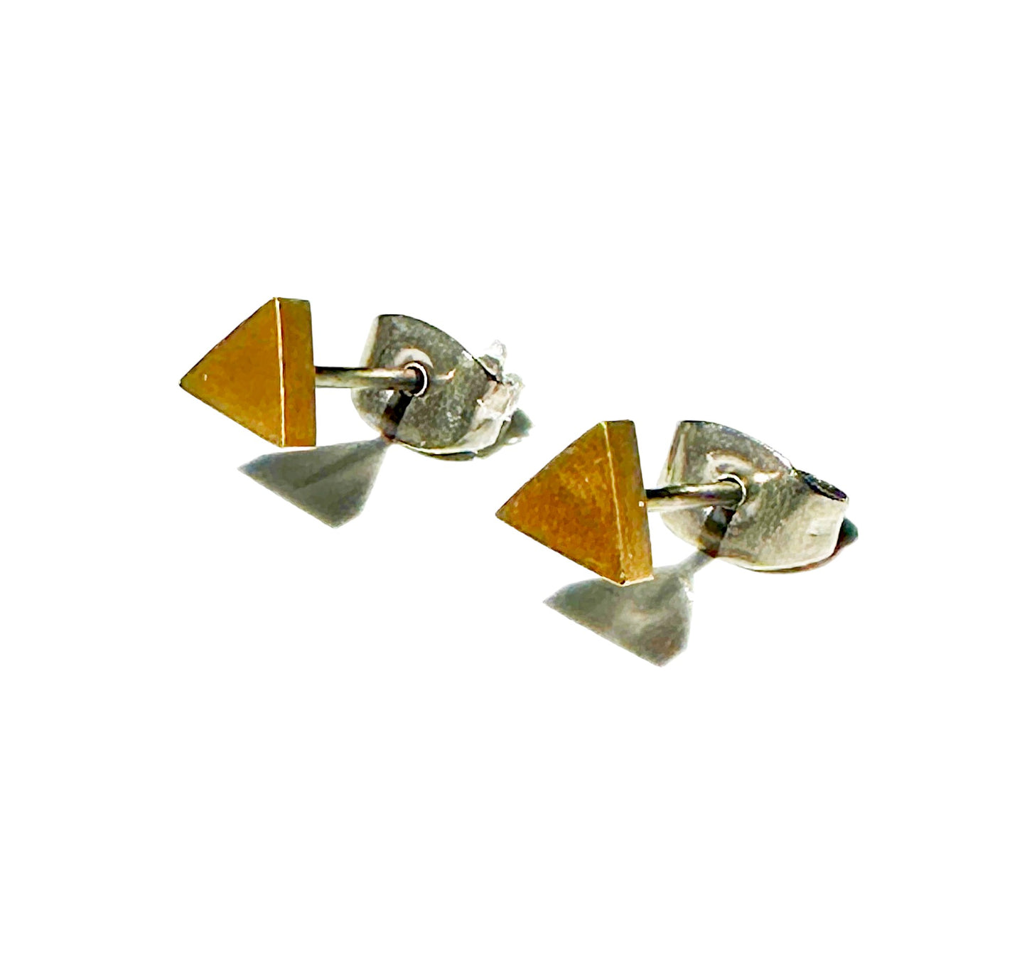 Mini titanium Gold Triangle Studs on a white background