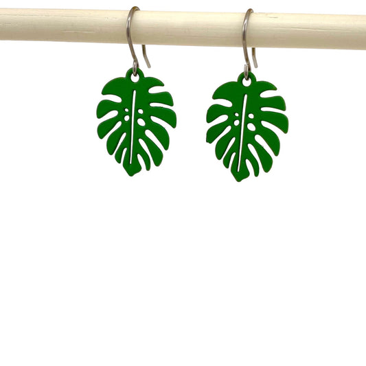 Monstera leaf earrings with a titanium hook on a white background