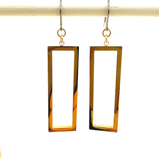 Rectangle mirrored gold earrings with a titanium hook on a white background