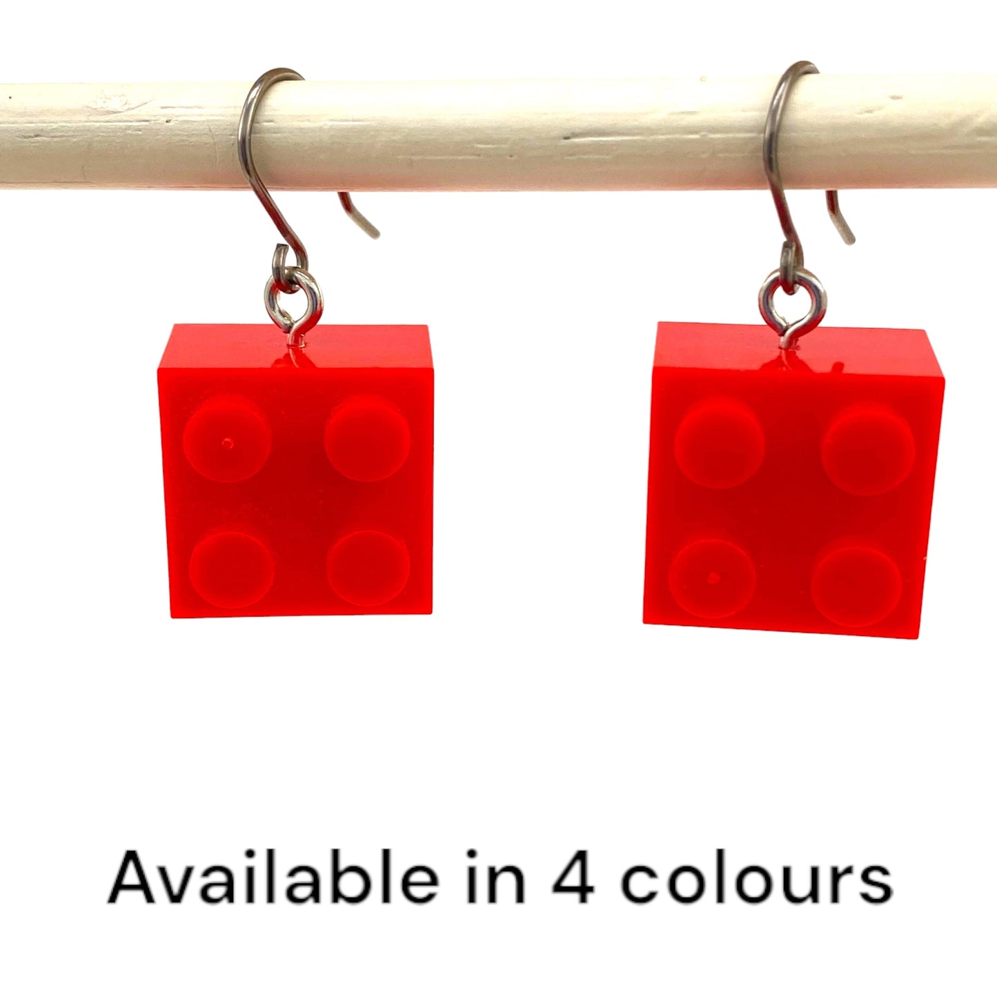 Lego block earrings with a titanium hook on a white background. red and colours