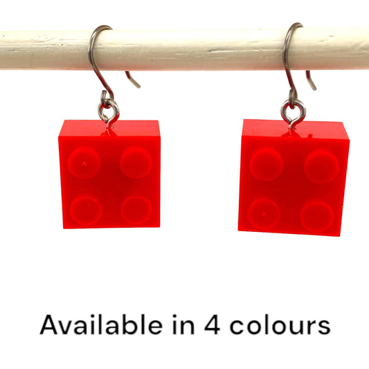 Lego block earrings with a titanium hook on a white background. red and colours