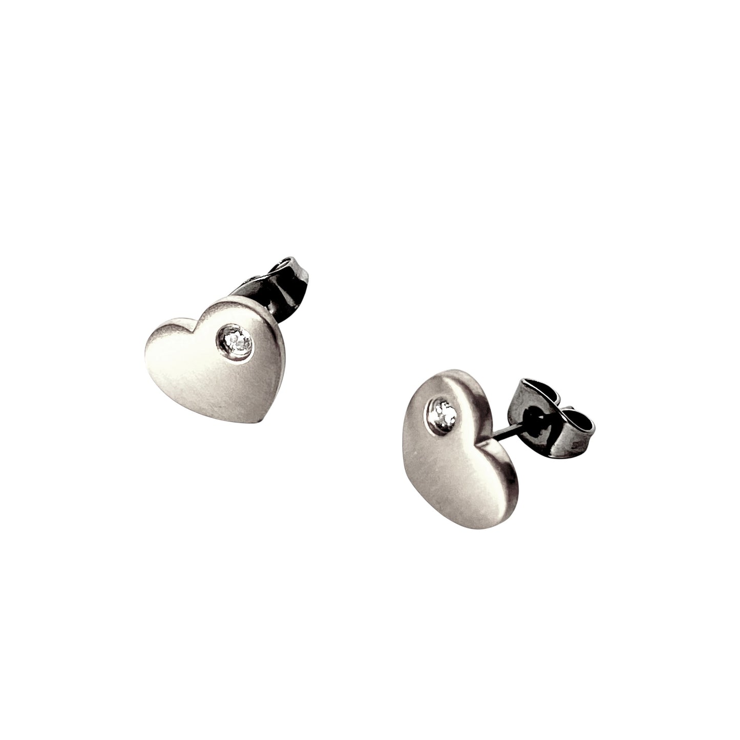 Heart-shaped titanium earrings in silveron a white background