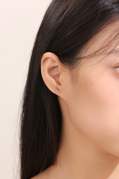 Moon  Studs Titanium Studs with titanium backs shown on a white woman