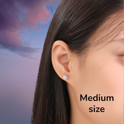 Flower ear studs with Gems. Titanium Studs 6mm adjustable fit studs shown on a woman.