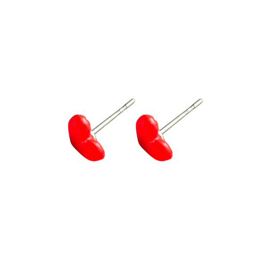 A pair of red heart-shaped stud earrings with titanium posts, shown on a plain white background.