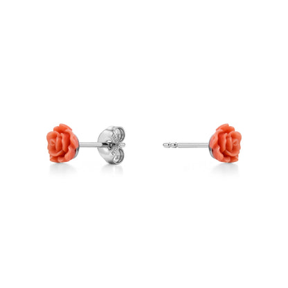 A pair of titanium stud earrings featuring beige rose-shaped enamel tops, shown on a clean white background with one earring facing forward and the other showing the backing.