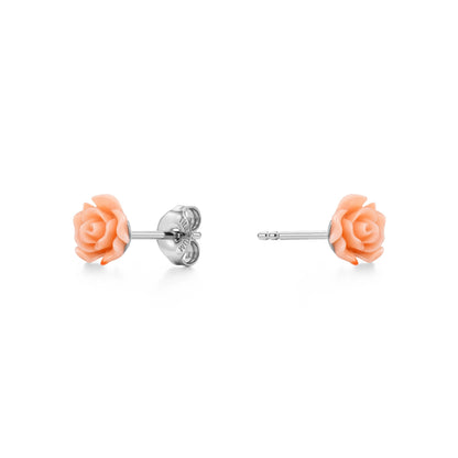 A pair of titanium stud earrings featuring pastel rose-shaped enamel tops, shown on a clean white background with one earring facing forward and the other showing the backing.