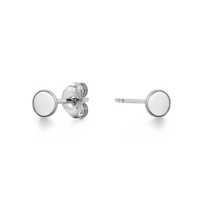 A pair of titanium stud earrings with flat circular disc faces, one shown from the front and the other from the side/back view, on a clean white background.